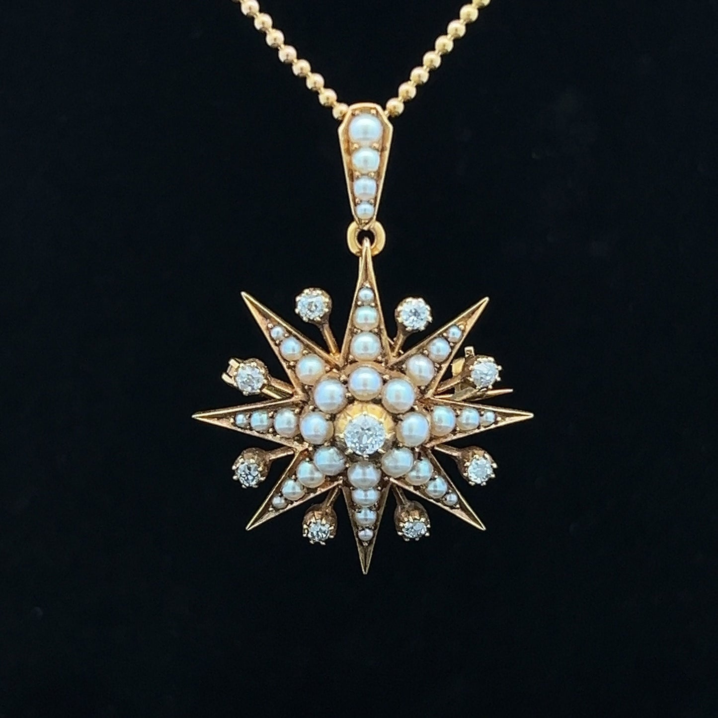 Antique Diamond and Natural Split Pearl High Carat Gold Star Pendant / Brooch in Original Fitted Case. English. Victorian. Circa 1892.