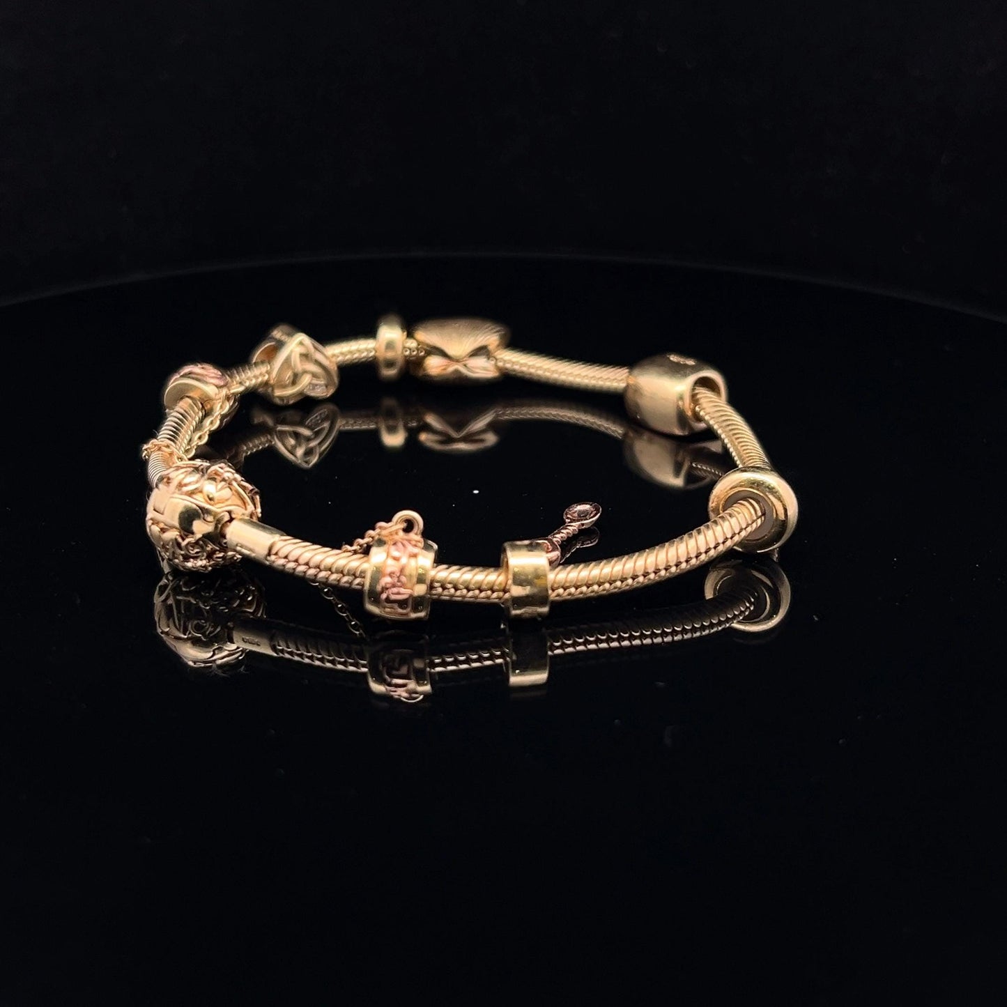 9ct Clogau Gold Milestones Charm Bracelet. Rare Welsh Gold. 4 Charms & Safety Chain. 7.5 inches U.K. Hallmarked. Pre-Owned Excellent Value.