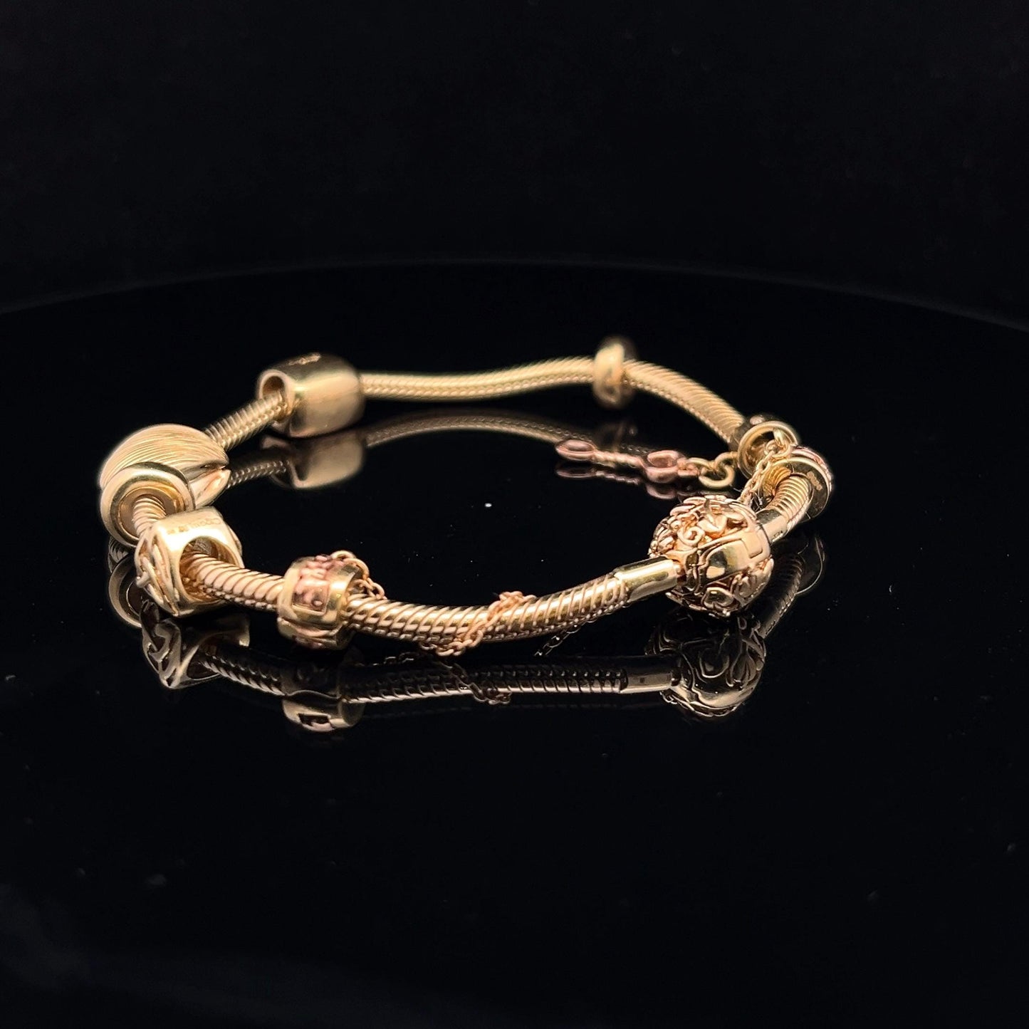 9ct Clogau Gold Milestones Charm Bracelet. Rare Welsh Gold. 4 Charms & Safety Chain. 7.5 inches U.K. Hallmarked. Pre-Owned Excellent Value.