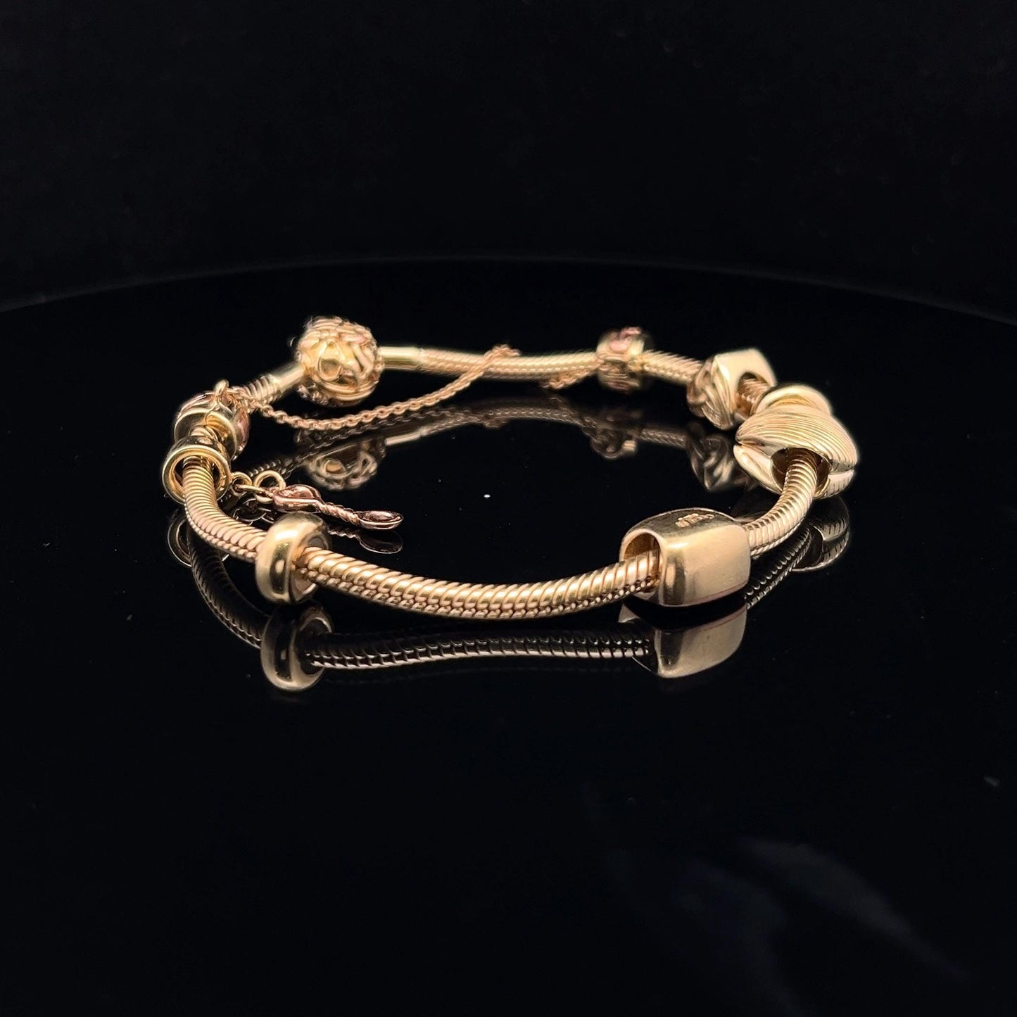 9ct Clogau Gold Milestones Charm Bracelet. Rare Welsh Gold. 4 Charms & Safety Chain. 7.5 inches U.K. Hallmarked. Pre-Owned Excellent Value.