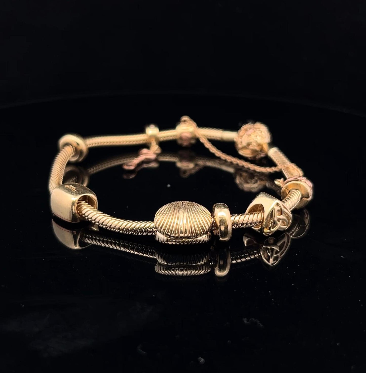 9ct Clogau Gold Milestones Charm Bracelet. Rare Welsh Gold. 4 Charms & Safety Chain. 7.5 inches U.K. Hallmarked. Pre-Owned Excellent Value.