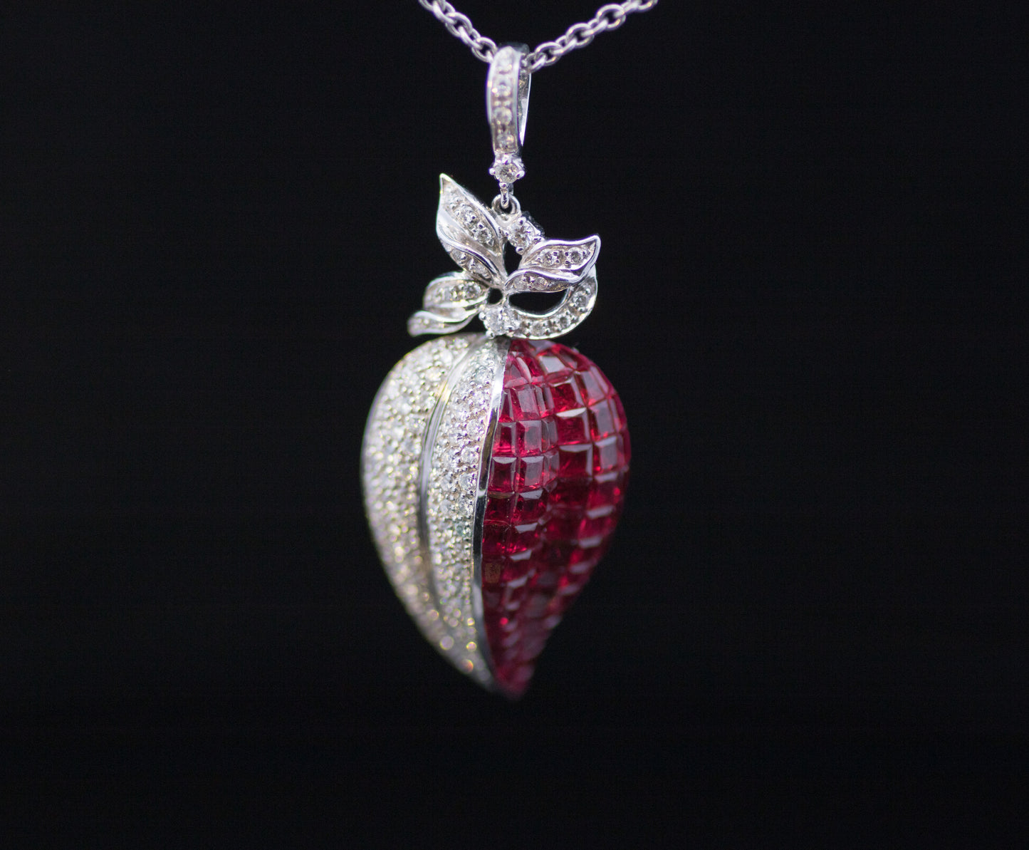 Retro 9ct White Gold Diamond and Ruby Stylised Heart Pendant. Calibre ' Invisible Set' Rubies
