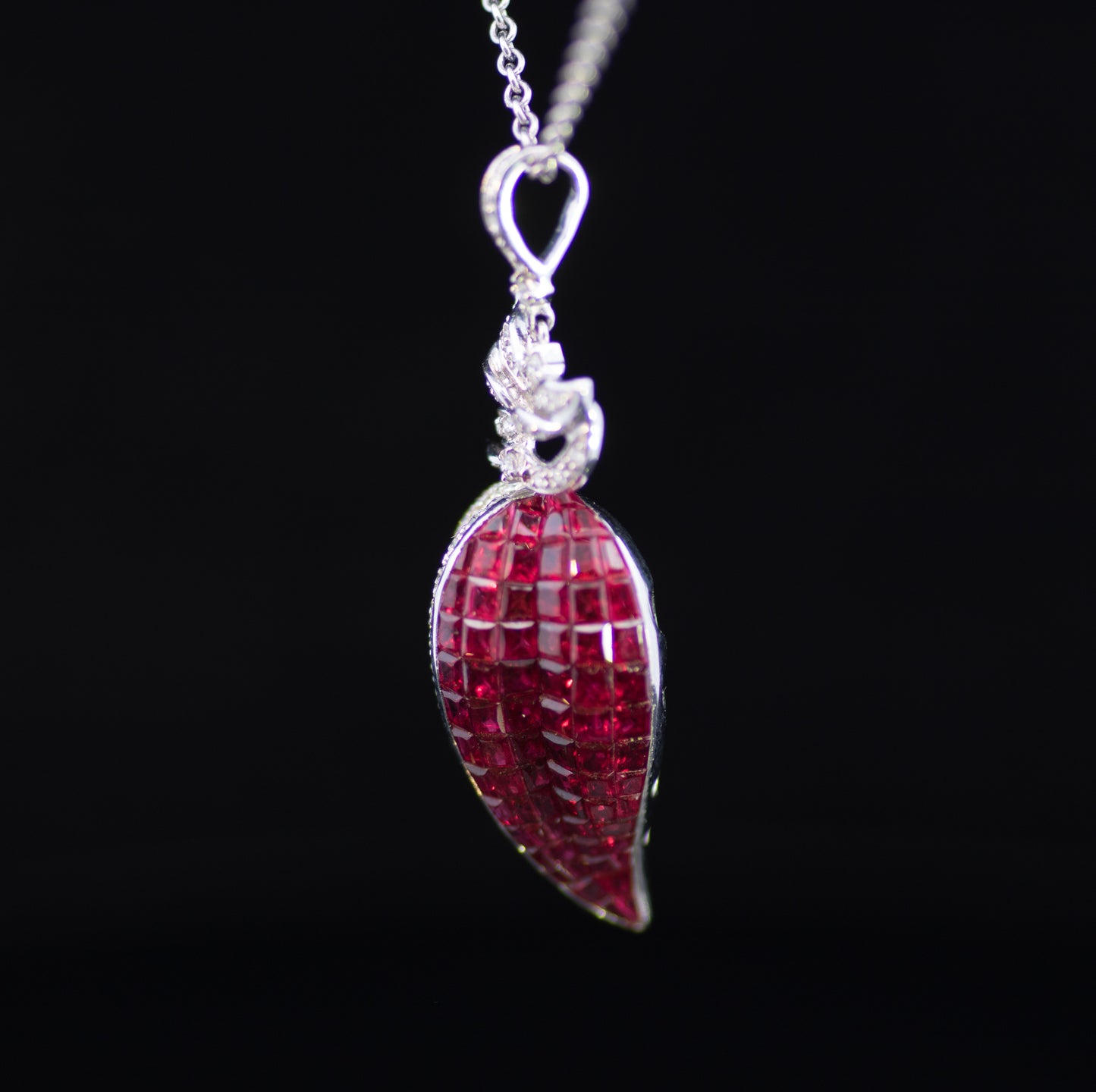 Retro 9ct White Gold Diamond and Ruby Stylised Heart Pendant. Calibre ' Invisible Set' Rubies
