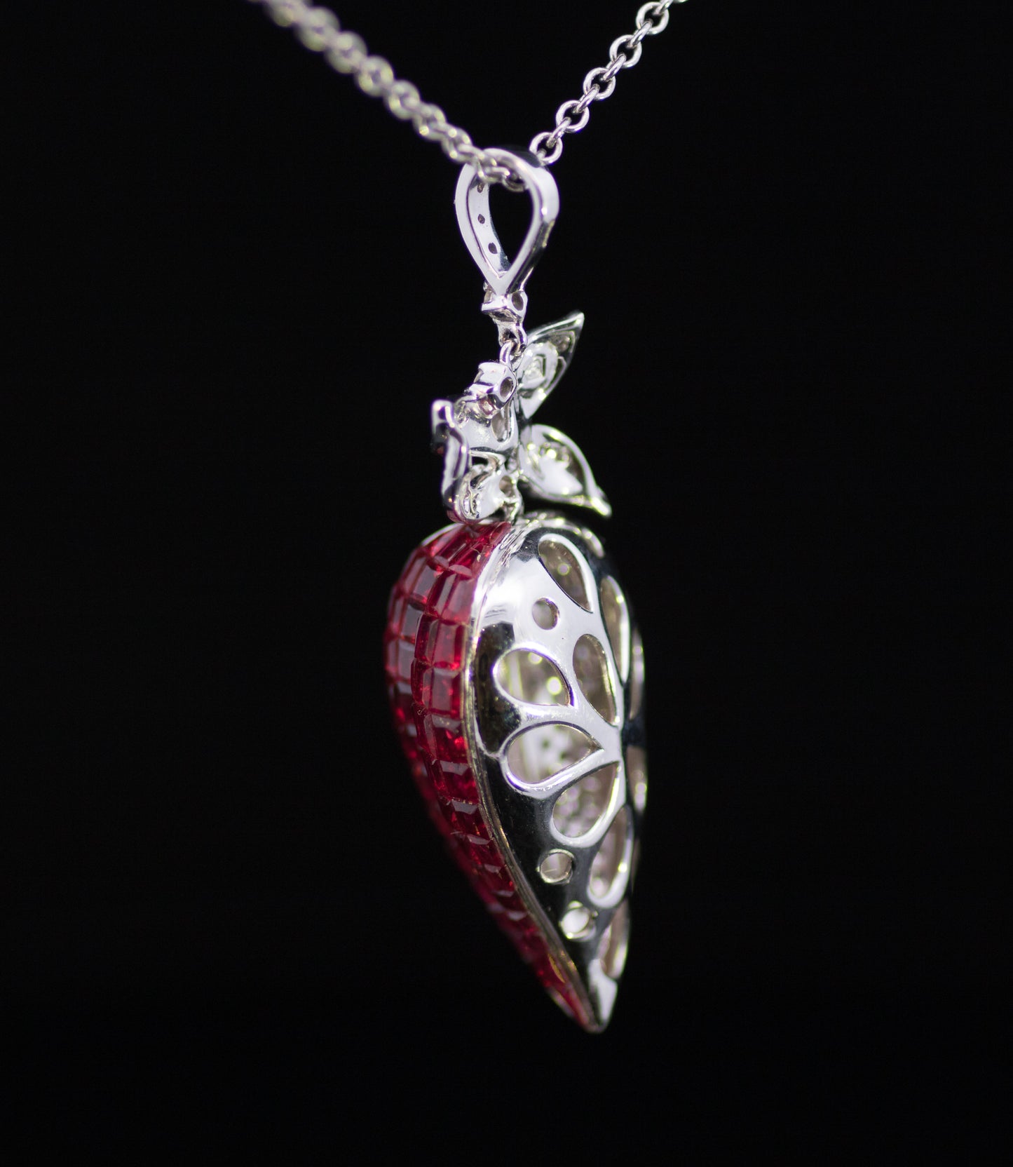 Retro 9ct White Gold Diamond and Ruby Stylised Heart Pendant. Calibre ' Invisible Set' Rubies