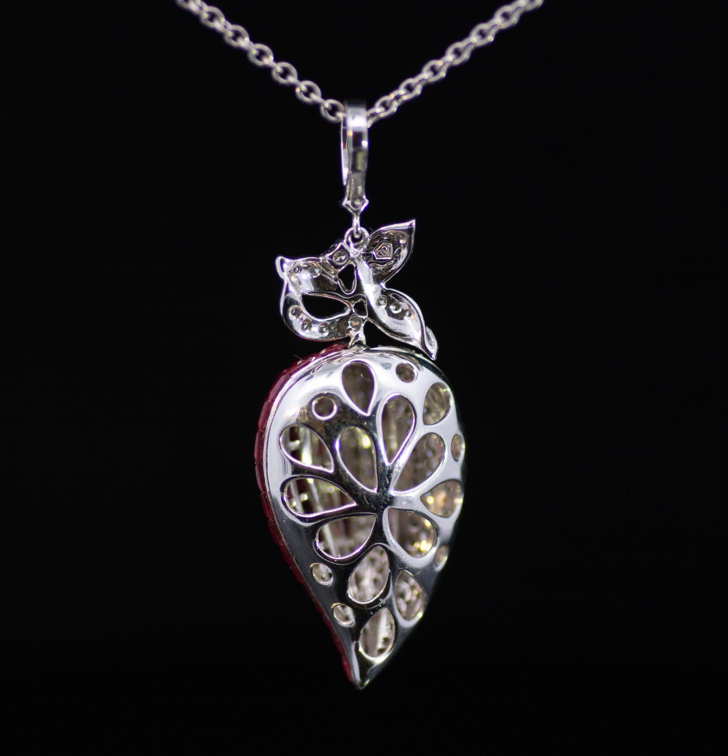 Retro 9ct White Gold Diamond and Ruby Stylised Heart Pendant. Calibre ' Invisible Set' Rubies