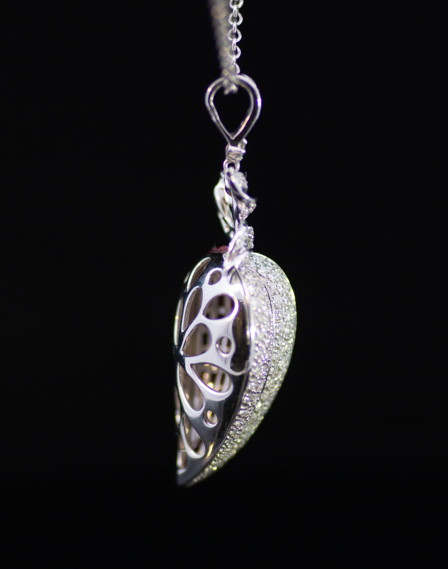 Retro 9ct White Gold Diamond and Ruby Stylised Heart Pendant. Calibre ' Invisible Set' Rubies