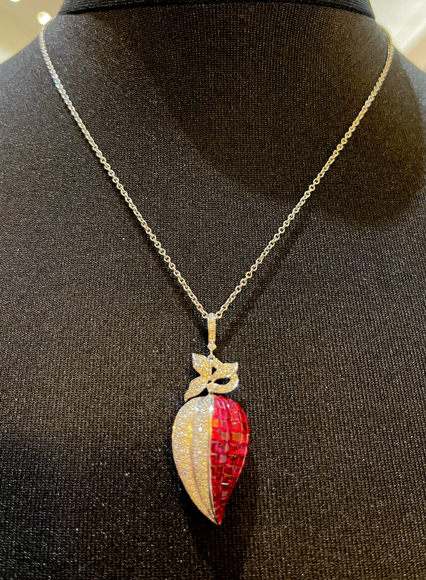 Retro 9ct White Gold Diamond and Ruby Stylised Heart Pendant. Calibre ' Invisible Set' Rubies