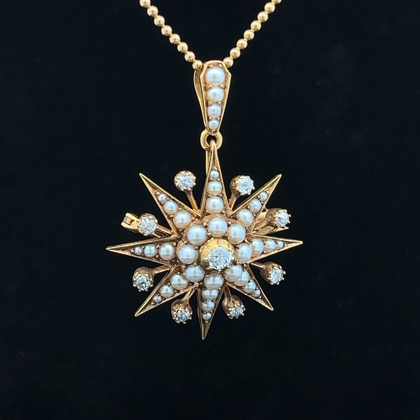 Antique Diamond and Natural Split Pearl High Carat Gold Star Pendant / Brooch in Original Fitted Case. English. Victorian. Circa 1892.
