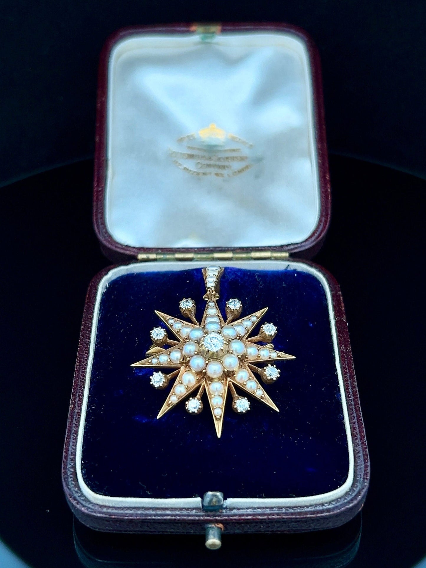 Antique Diamond and Natural Split Pearl High Carat Gold Star Pendant / Brooch in Original Fitted Case. English. Victorian. Circa 1892.